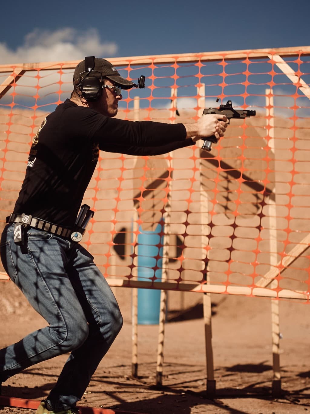 Shooter in action at a USPSA match